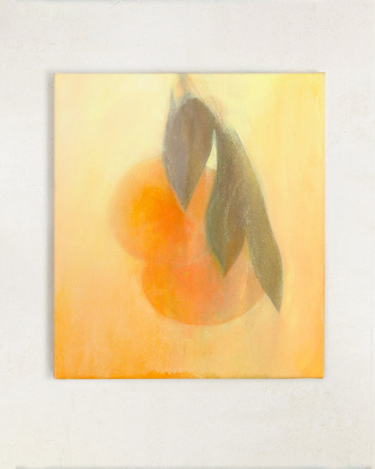 Abstract orange still life painting with citrus fruit and green leaves in warm golden tones, displayed on a neutral wall.