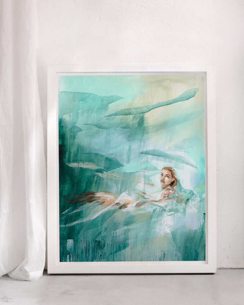 Framed art print of a woman floating in the ocean. Painted in a fresh turquoise against a white background.