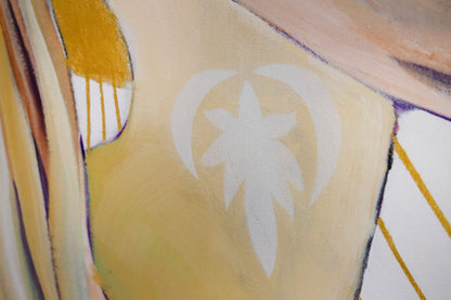 Close up detail of a lotus flower logo on the bodysuit of a woman practicing yoga.