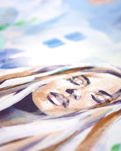 A close up detail of a giclee print of a woman face with a blue backdrop.