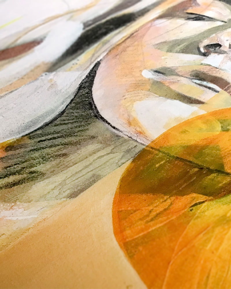Close up detail of a fine art print of a woman in orange and yellow.