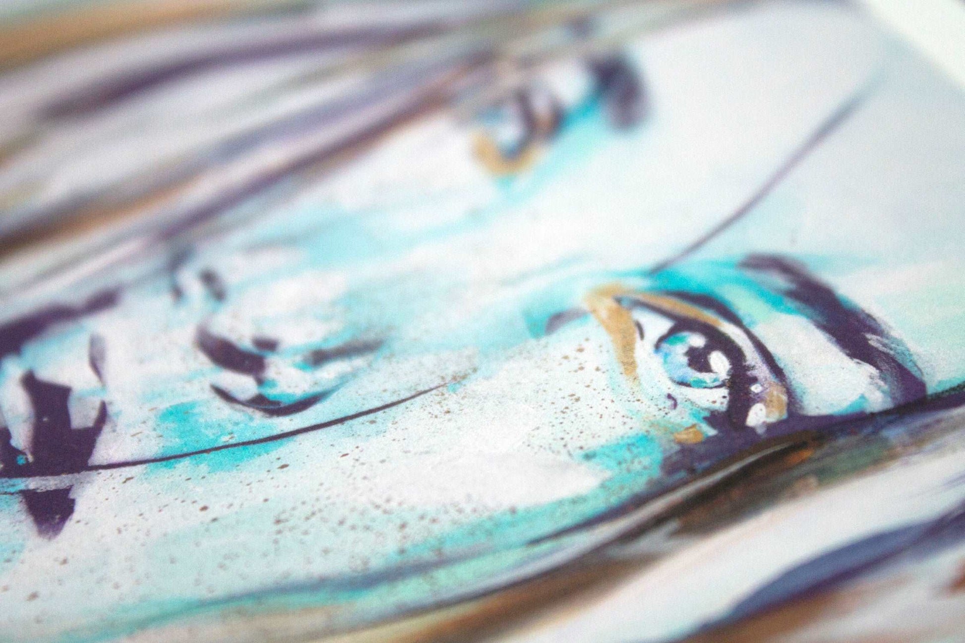 Close up detail of a turquoise eye in a bohemian portrait painting