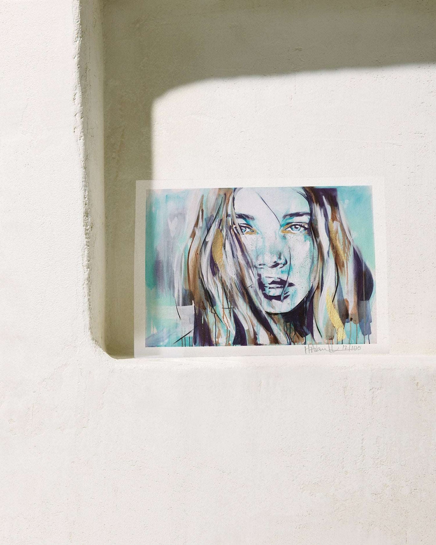 Turquoise Dream print by Hannah Adamaszek sitting on a plaster shelf, Mallorca style.