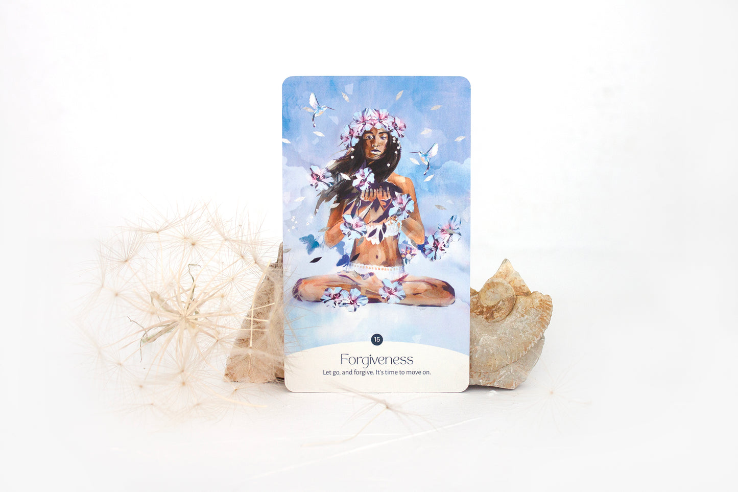 Forgiveness oracle card from the Golden Keys of Gaia deck featuring feminine, sky-blue elemental artwork symbolising release and healing