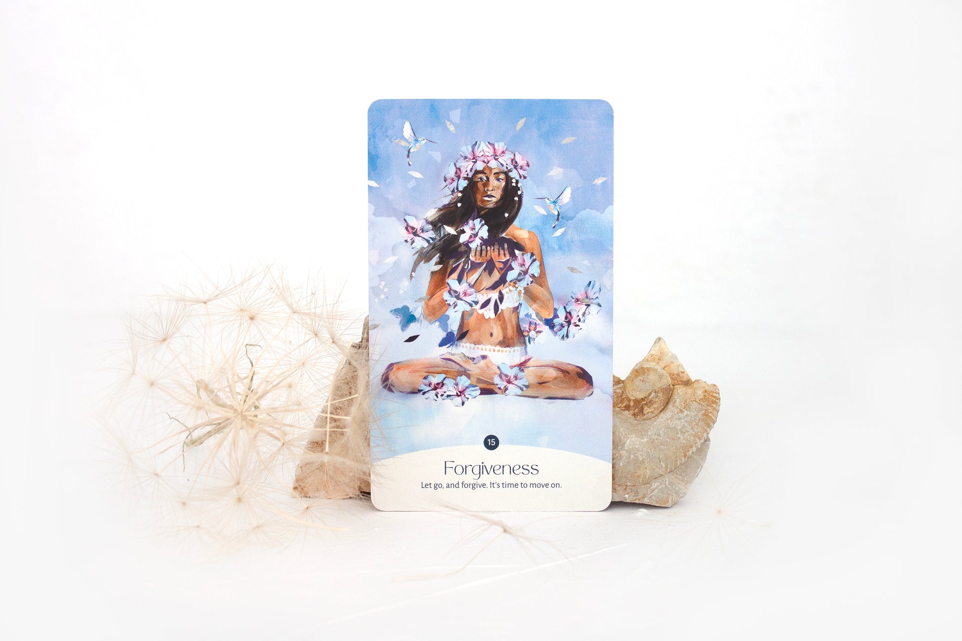 Forgiveness oracle card from the Golden Keys of Gaia deck featuring feminine, sky-blue elemental artwork symbolising release and healing