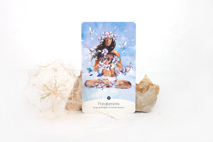 Forgiveness oracle card from the Golden Keys of Gaia deck featuring feminine, sky-blue elemental artwork symbolising release and healing