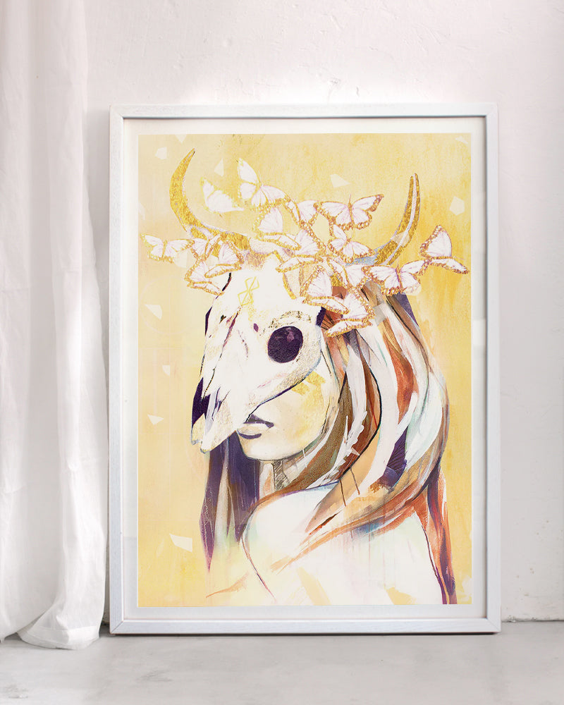 Spiritual art print titled Mask Off, depicting a woman with an animal skull mask adorned with butterflies in warm golden tones, symbolising transformation, truth, and release.