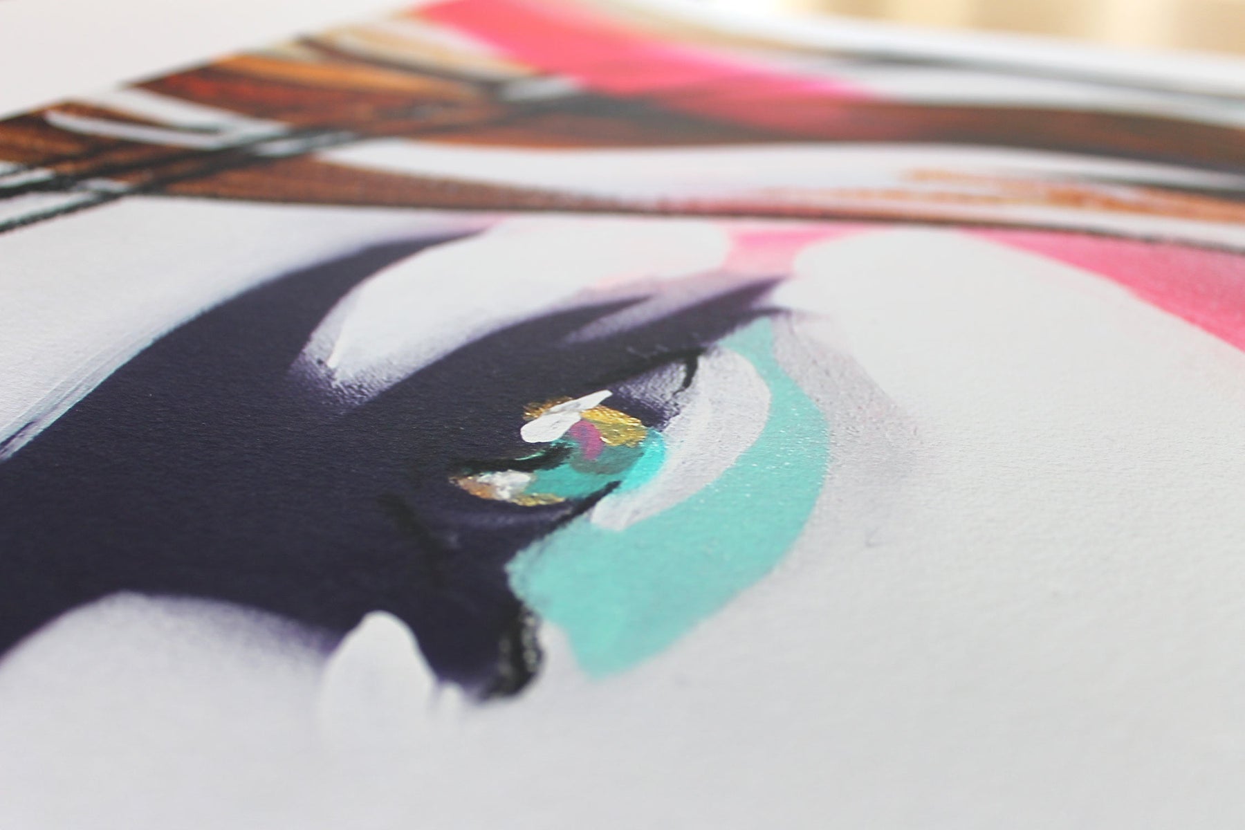 Close up detail of art print. Detail of the eye with turquoise and gold.
